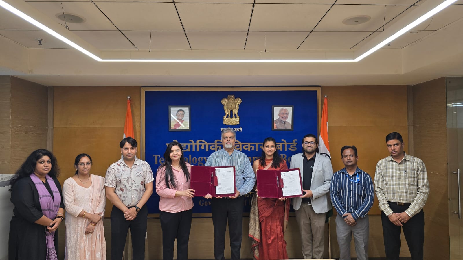 Griva Healthcare co-founders Nidun and Parvathi receiving signed project agreement from TDB Secretary Shri Rajesh Kumar Pathak in New Delhi for GrivaVision colposcope.